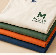 Stack of folded tees embroidered for Miller Landscapes