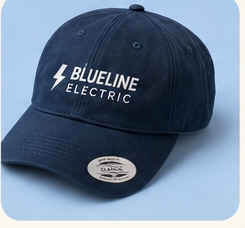 Navy dad cap printed with the Blueline Electric logo